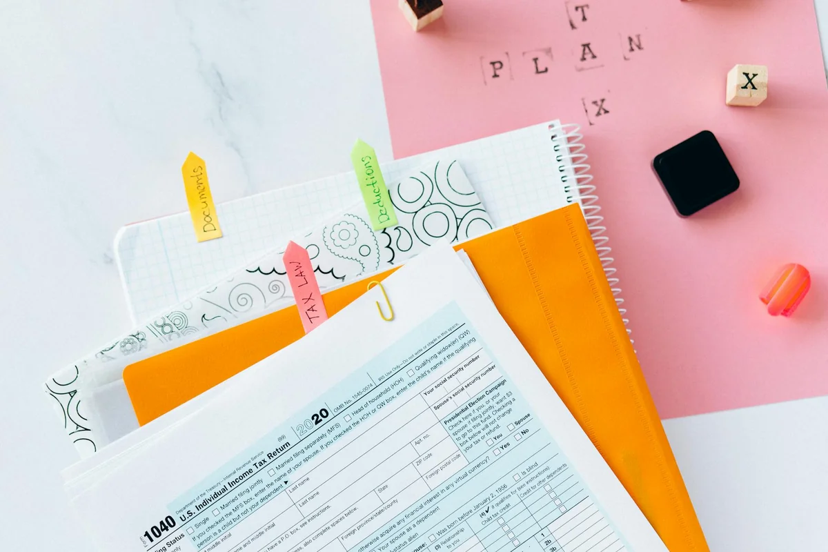 Tax documents aur paperwork desk view